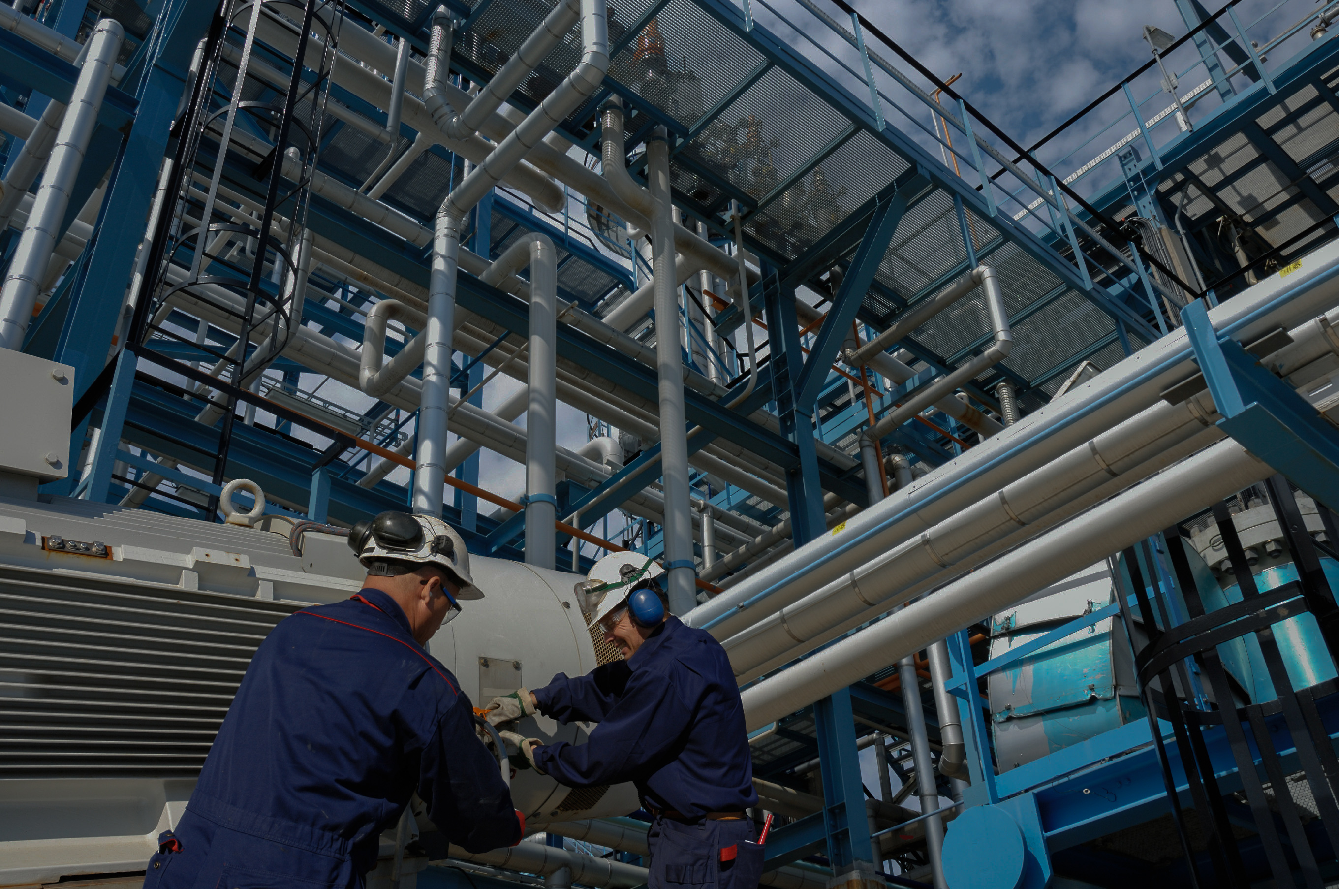 Engineers in hardhats in Industrial setting