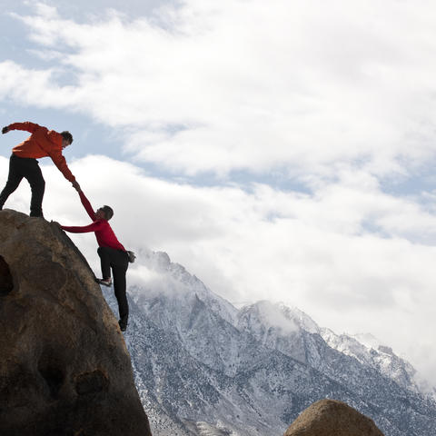 Image of hikers on a mountain top
